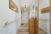 Flur (Ansicht 2) - Top gepflegte 3-Zi.-EG-Wohnung mit Südgarten & TG-Stellplatz!
